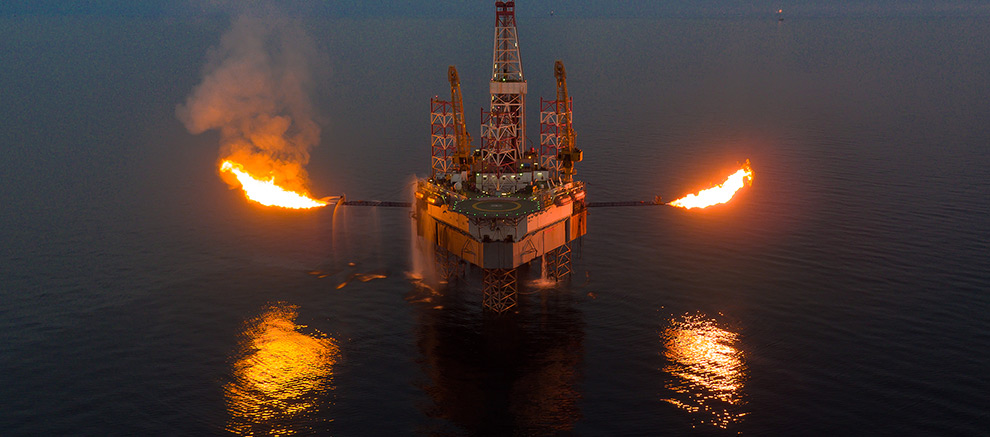 Car on the road with surroundings of sea and mountains